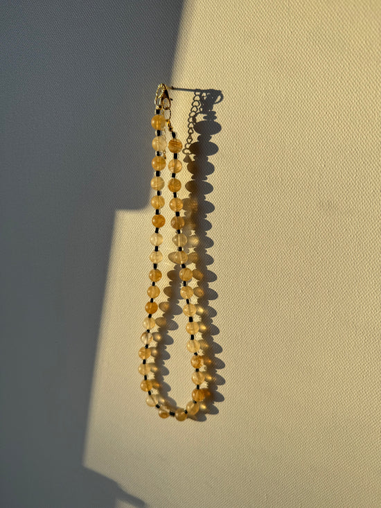 Yellow Citrine Stone w/ half transparent black glass spacer